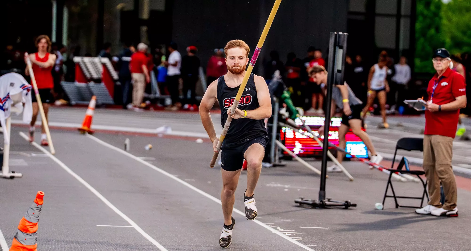 Colin Beers running down the pole vault shoot