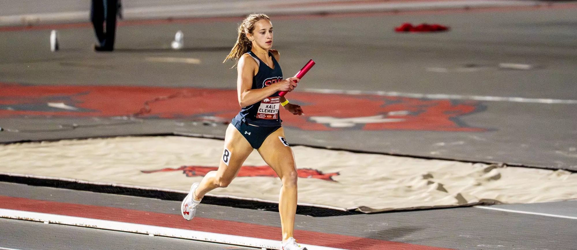 Kale Clements starts the straight on her leg of the relay