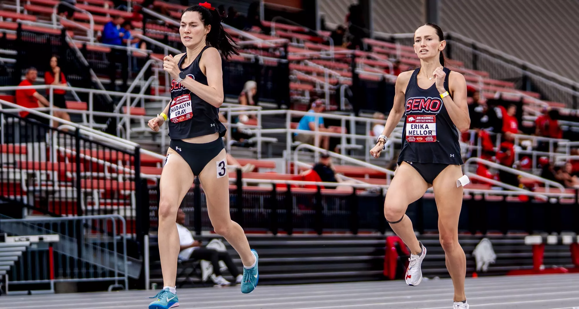 Erika Mellor chases down teammate Madalyn Gray at the end of the 800m race