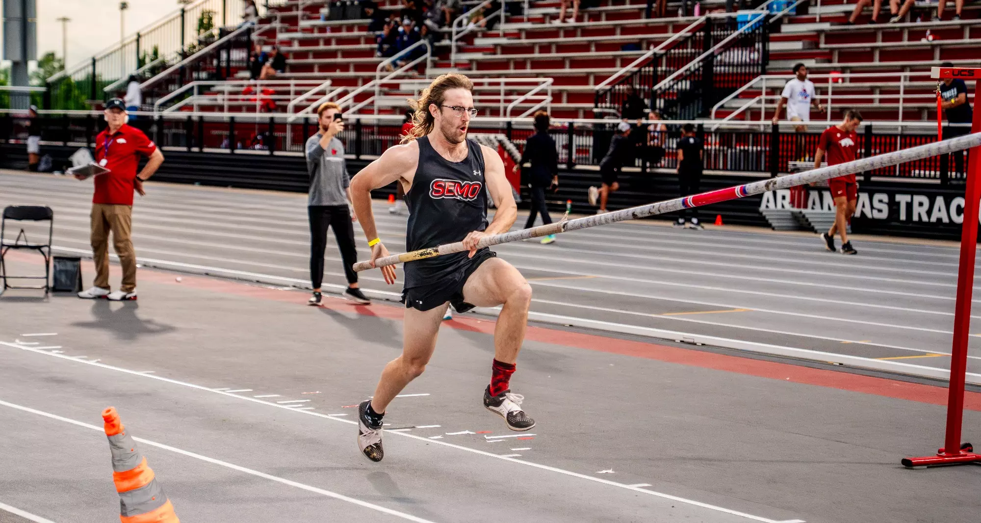 Sullivan Gleason eyes down his pole vault plant spot to clear the bar