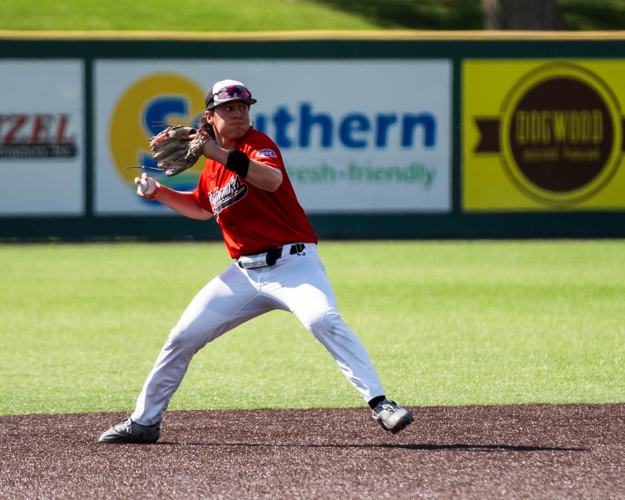 Andrew Ramirez throwing a baseball from short stop