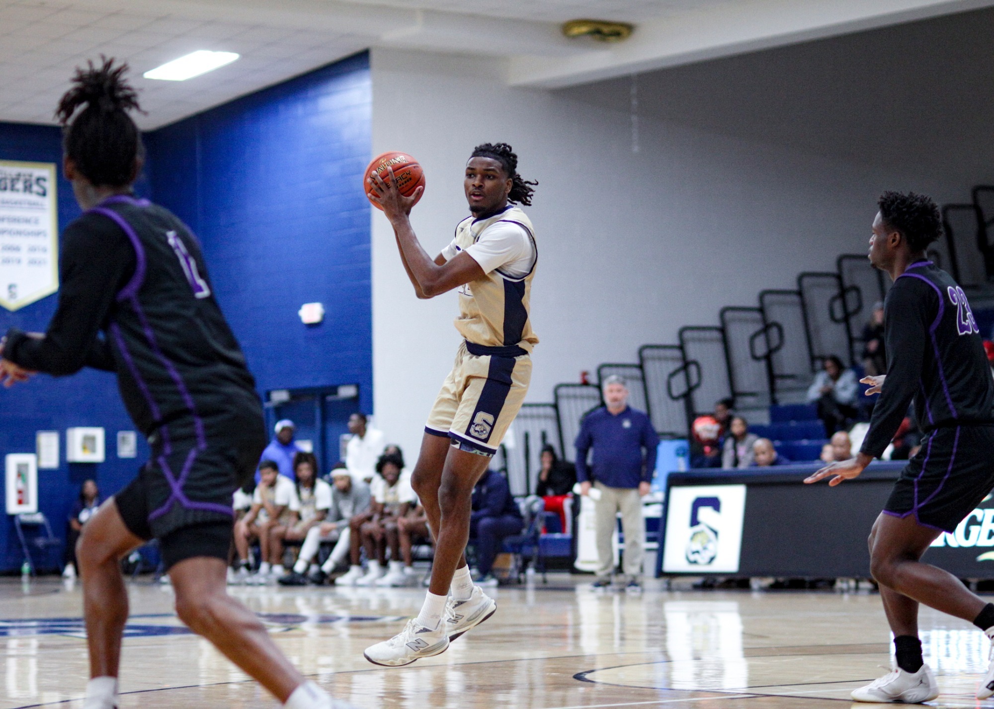 Allister Dixon passing the ball in mid-air