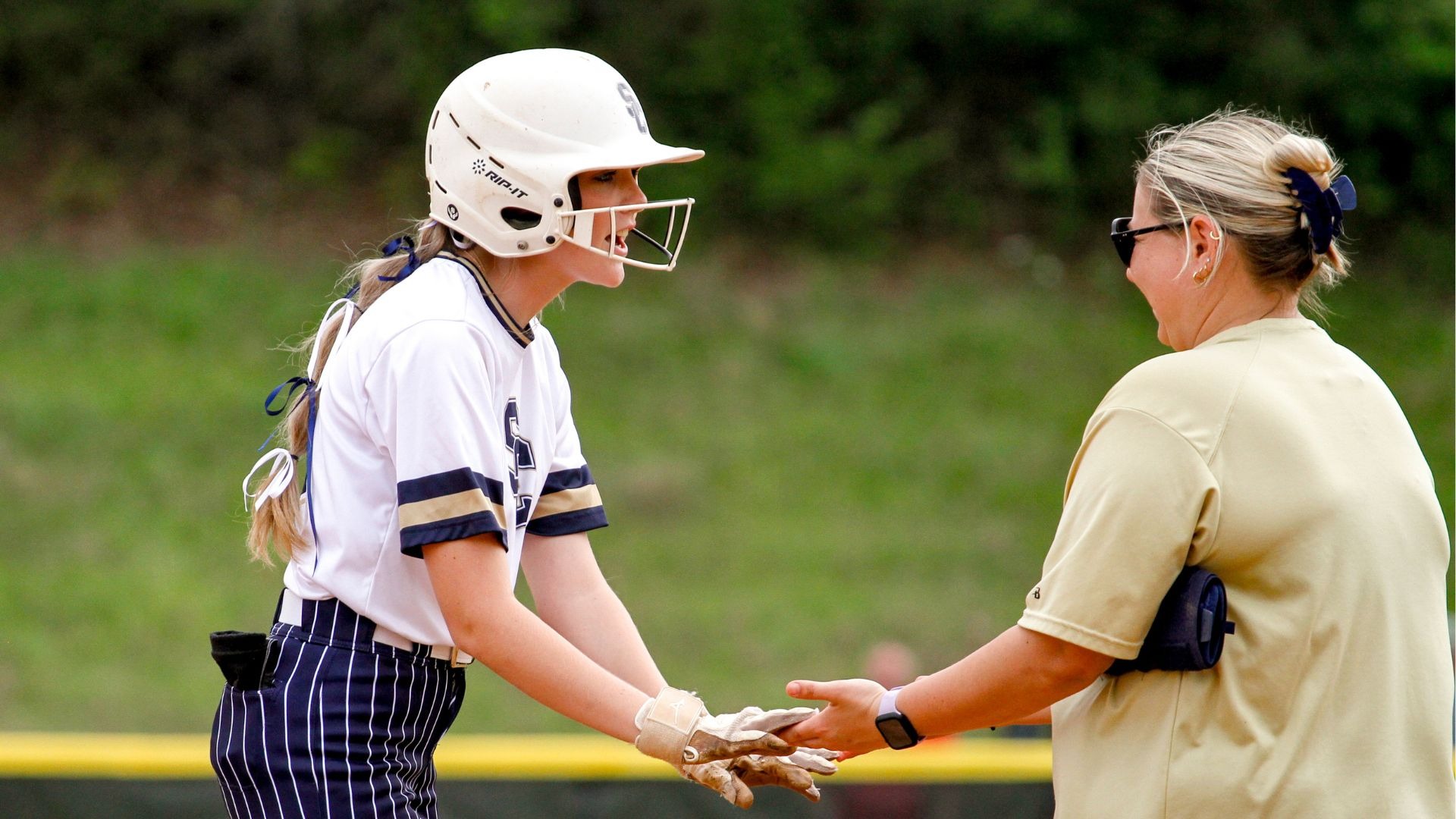 Addison Seale celebrates with coach Katie Clifton