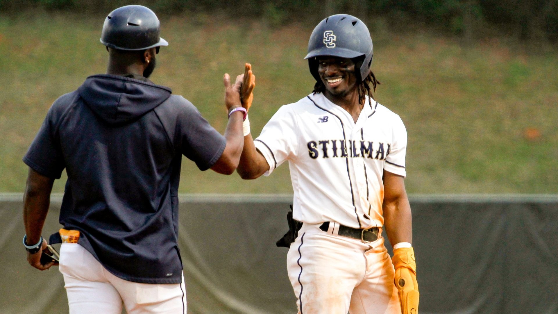 Stillman baseball player celebrates reaching third base