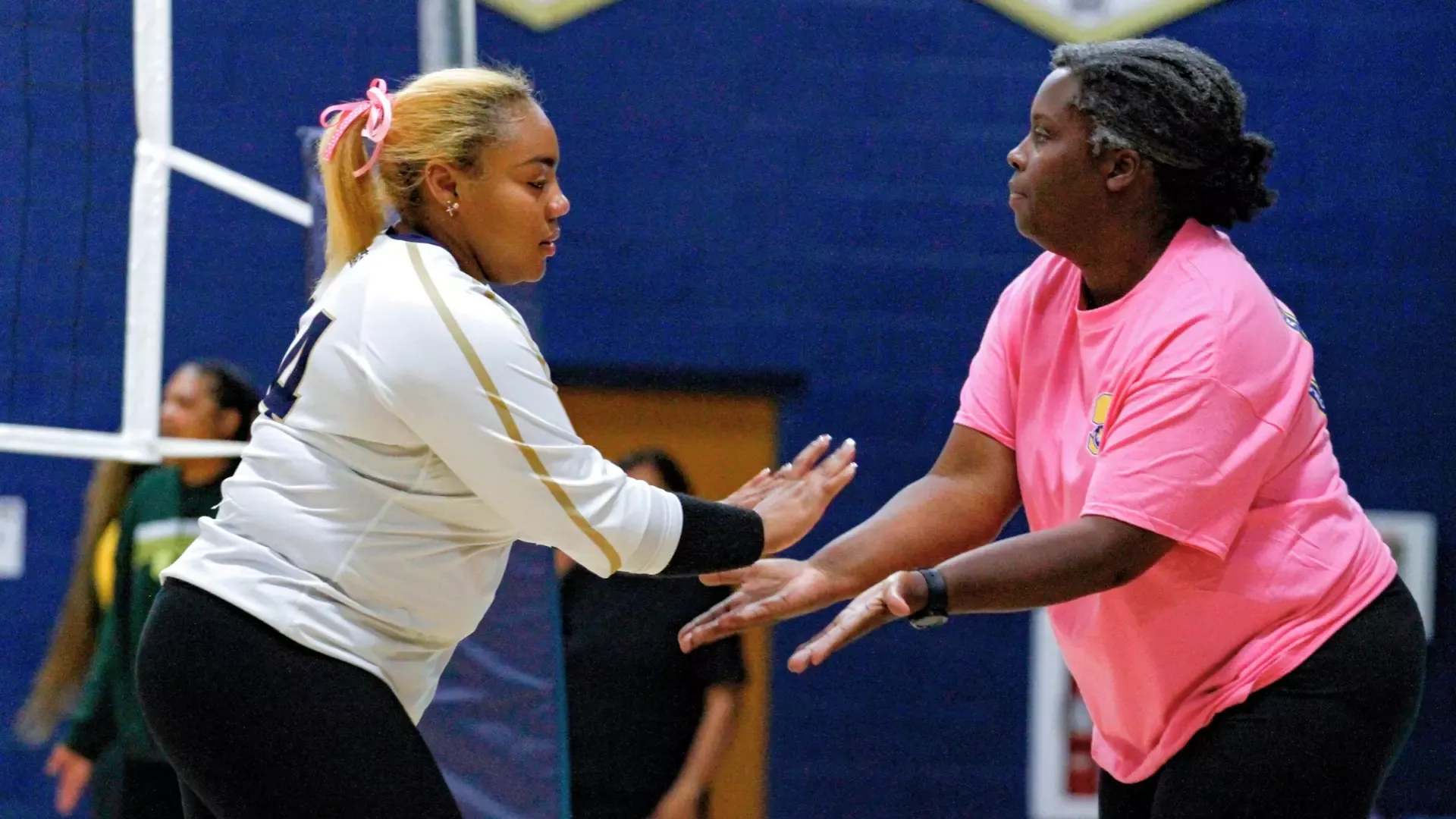 Zoey Sales and Theresa Franks slap hands