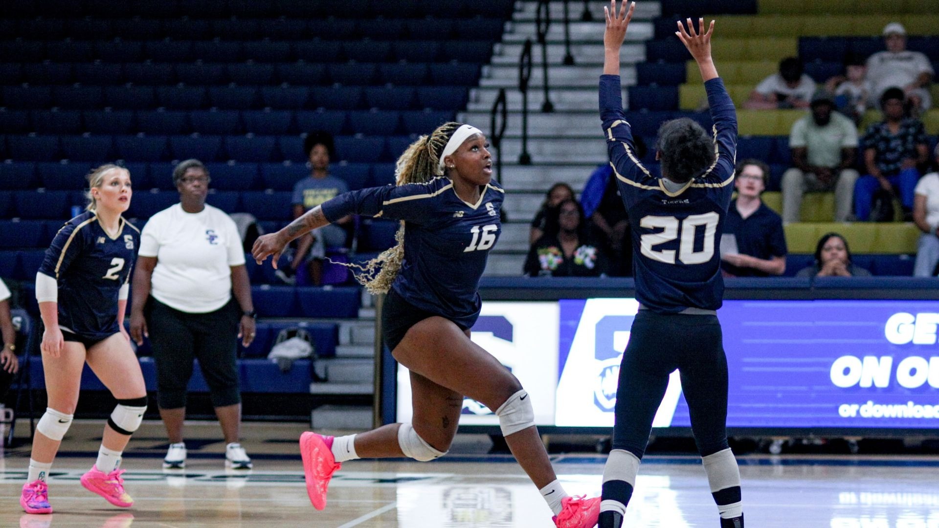 Ava on the attack, Karen White with the set, Shelby Morris watching