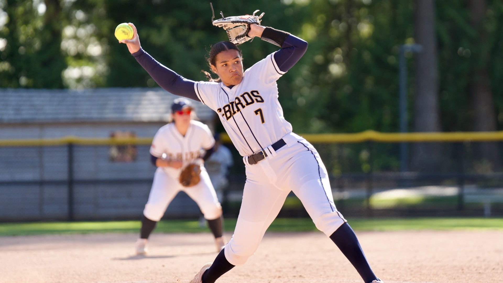 Carleen Murray early in her delivery on the rubber, arm about the whip around and release the pitch