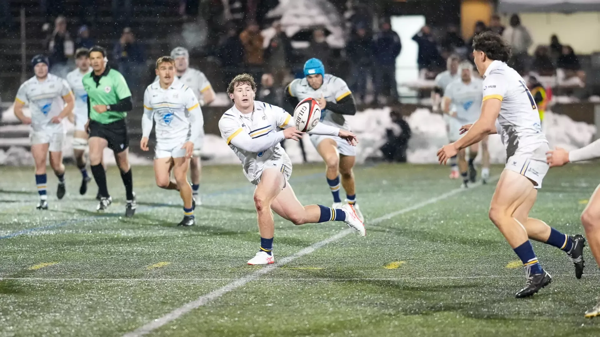 a UBC player passes the ball to a teammate during open play