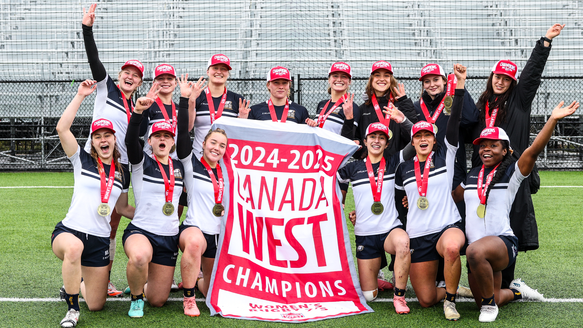 The victorious UBC team holds up the 2024-25 Canada West championship banner