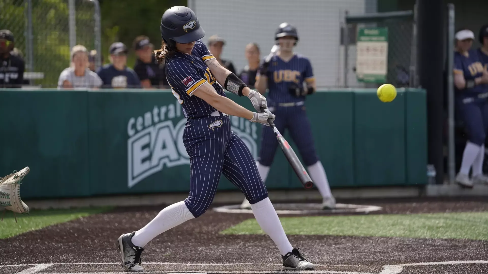 Madison MacGillivray follows-through on her swing after making contact with the ball