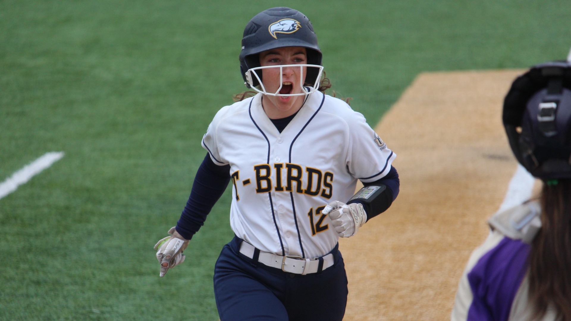 Marin Jorgenson has a yell of celebration as she is about to cross home plate