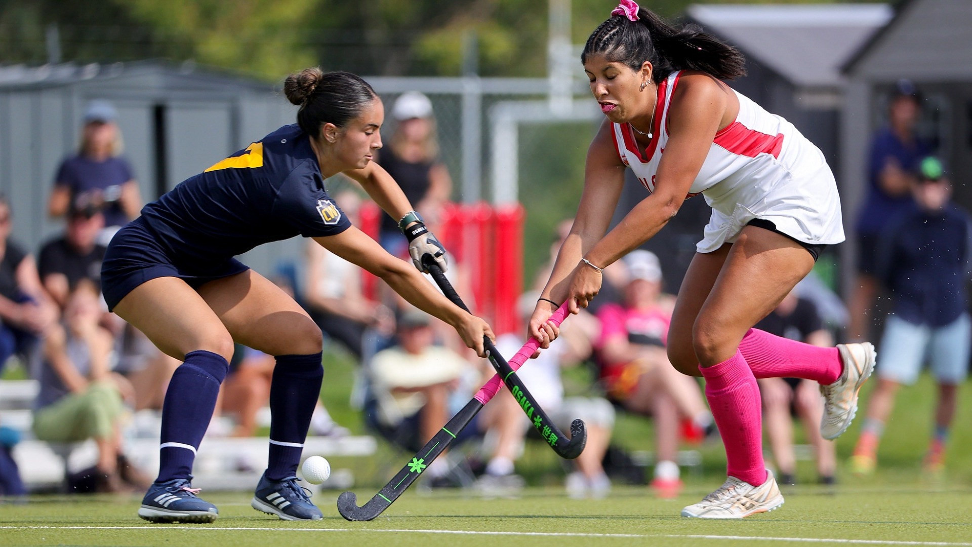 Kaitlyn Pennefather battles for the ball against a Calgary player