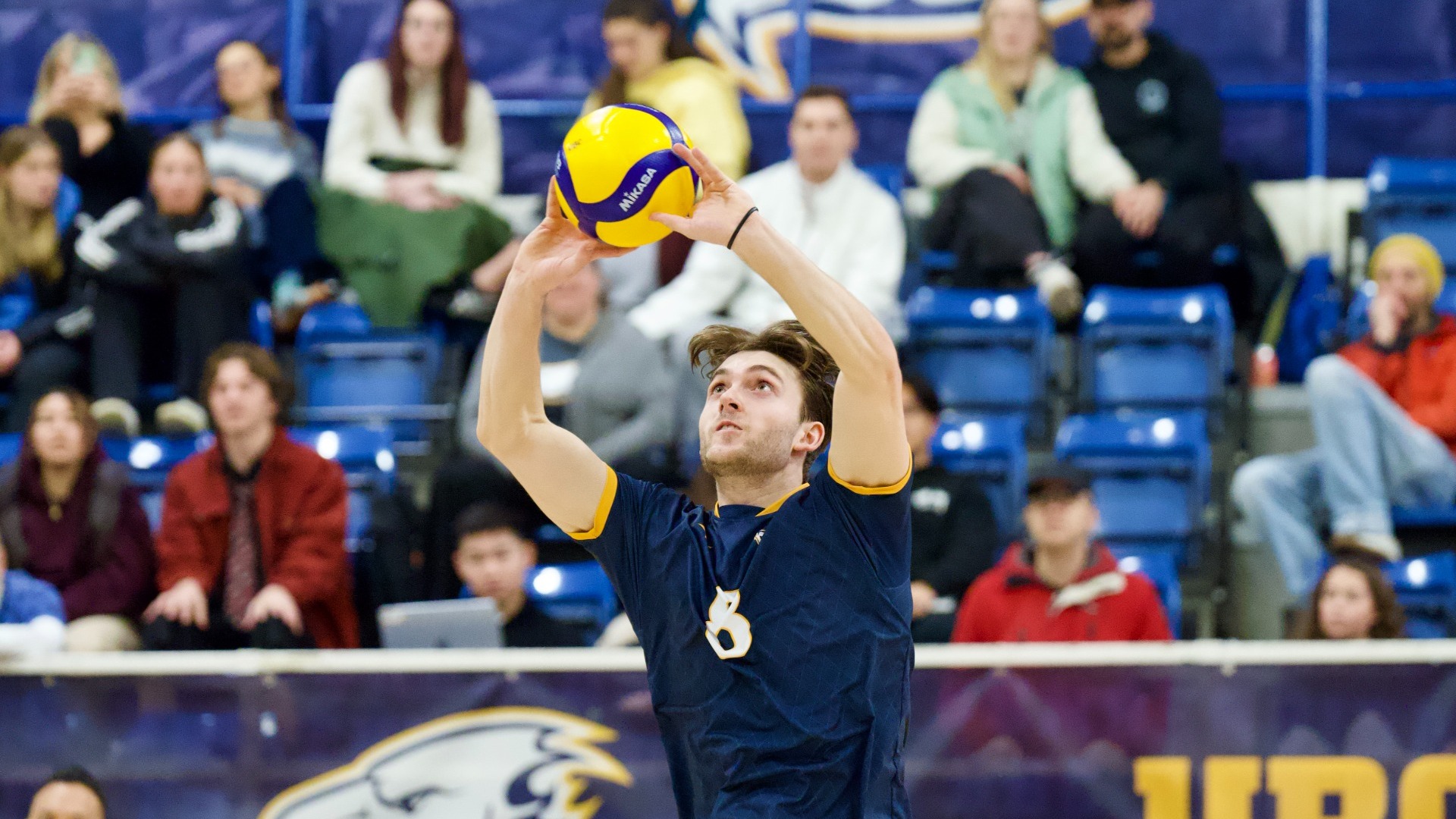 Mason Greves sets the ball over his head