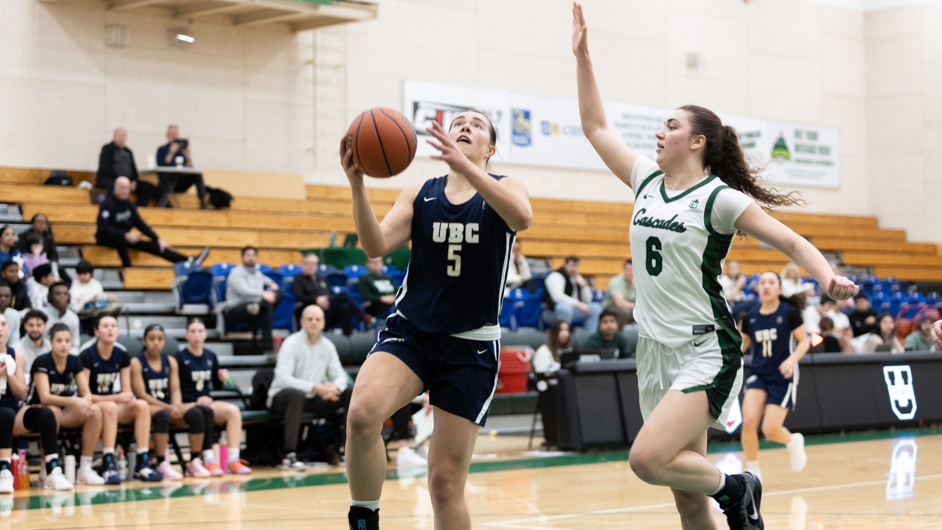 Jaeli Ibbetson goes up for a layup while a UFV defender tries to come in to block it