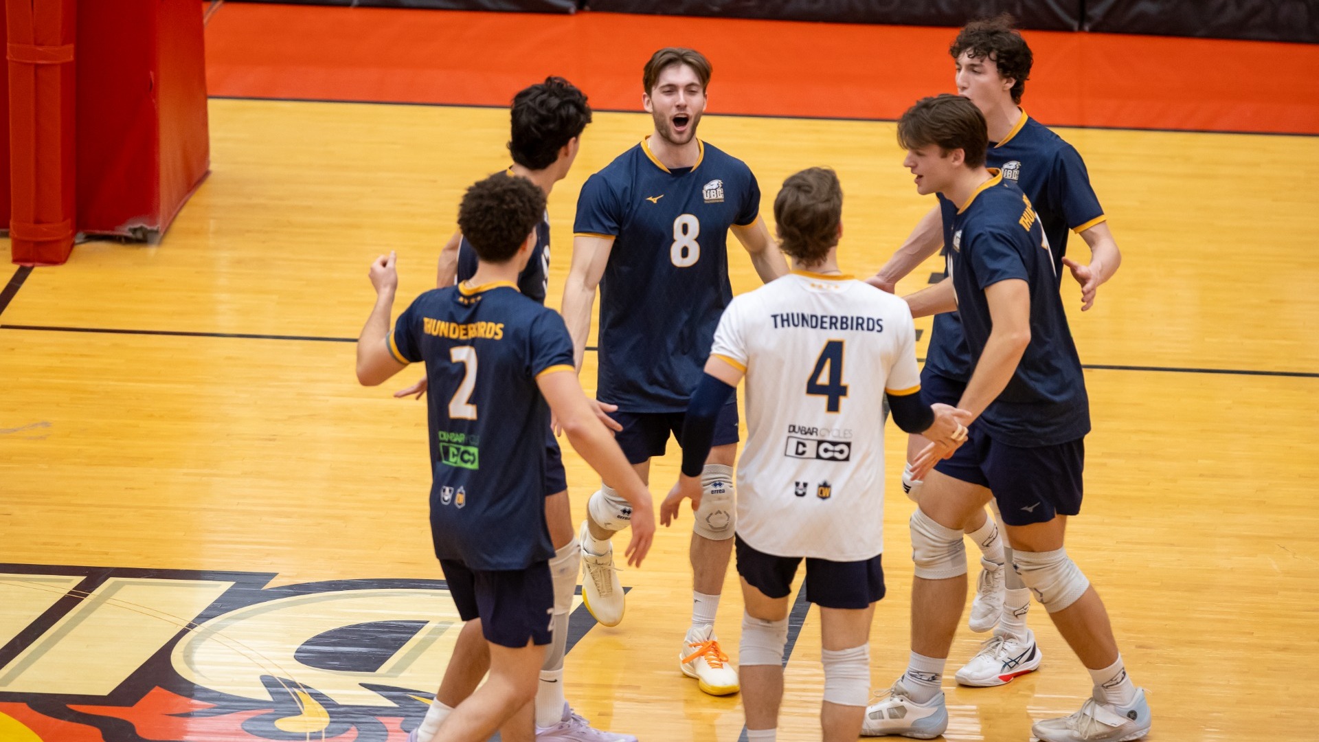 The Thunderbirds come together in a group to celebrate after a point