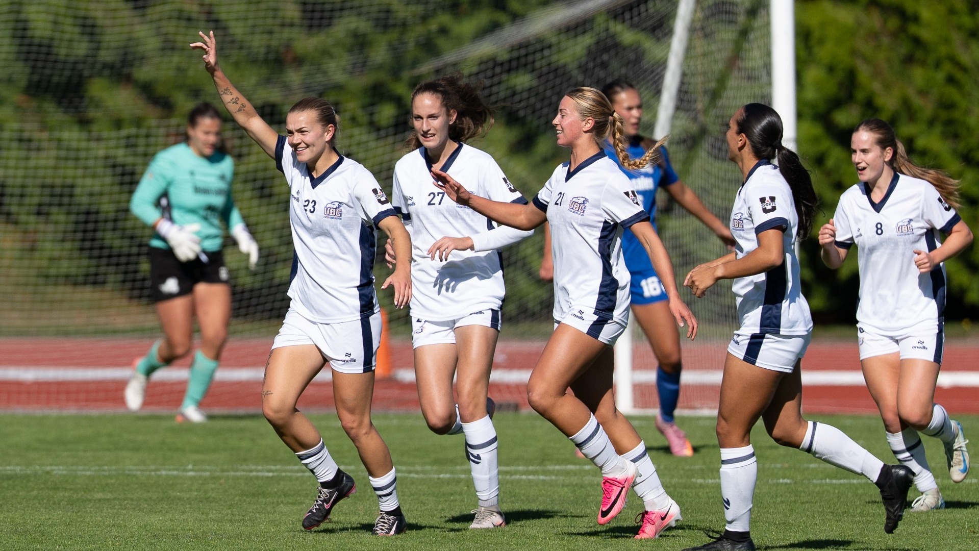 UBC's Maddy Norman celebrates her first-half goal with teammates trailing behind during a game agains the UVic Vikes on Oct. 11, 2026