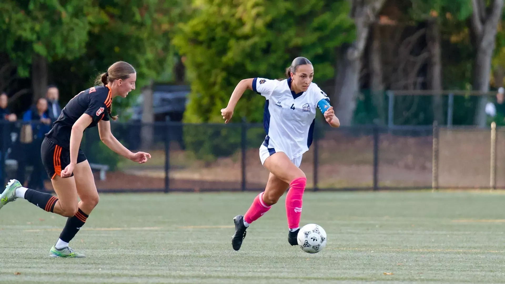 UBC's Sophia Ferreira dribbles the ball away from an incoming defender during a game against the TRU Wolfpack on Oct. 16, 2026