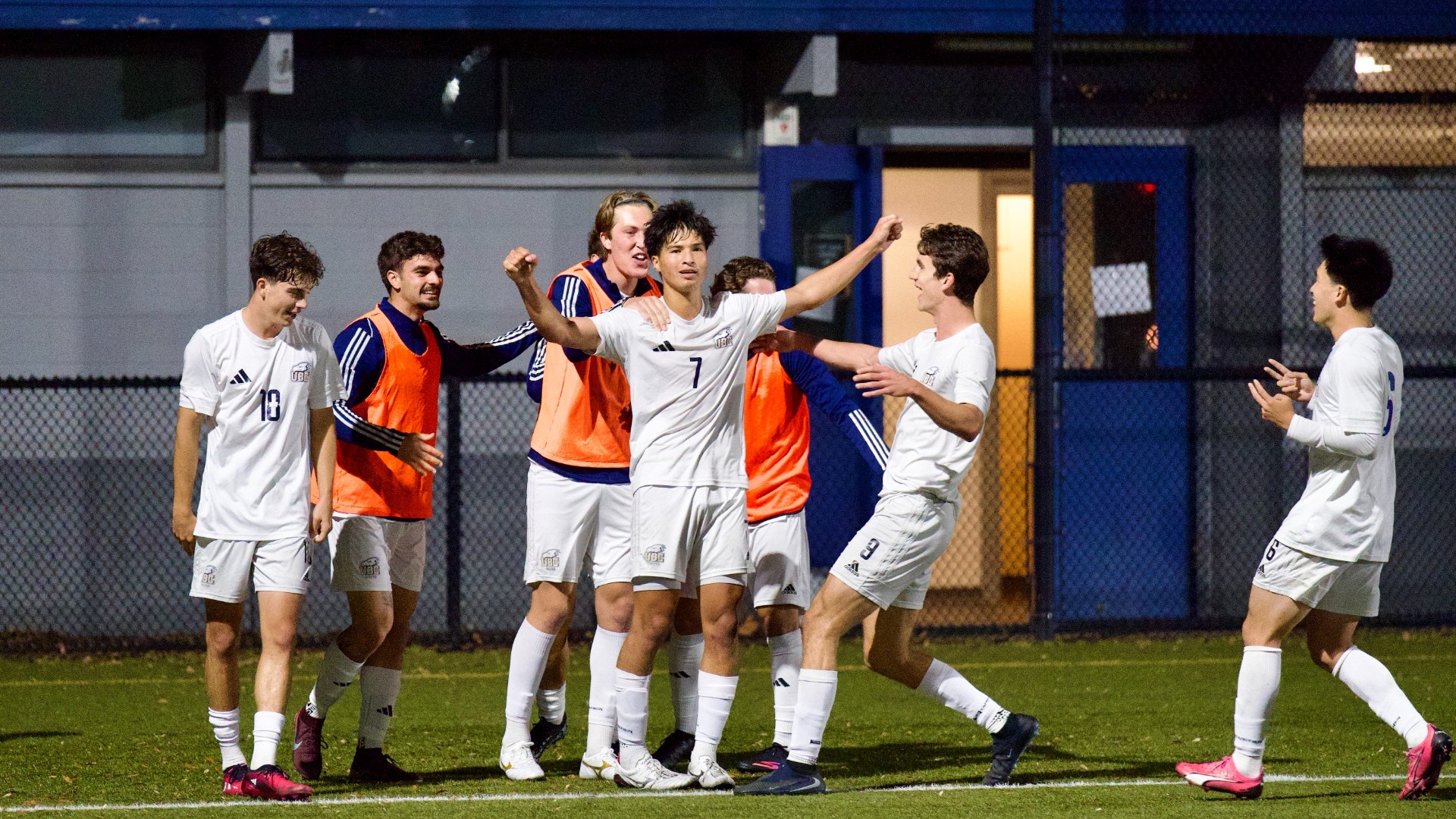 UBC's Henri Godbout celebrates his second goal of the game as multiple teammates join in during a game against the TRU Wolfpack on Oct. 16, 2026