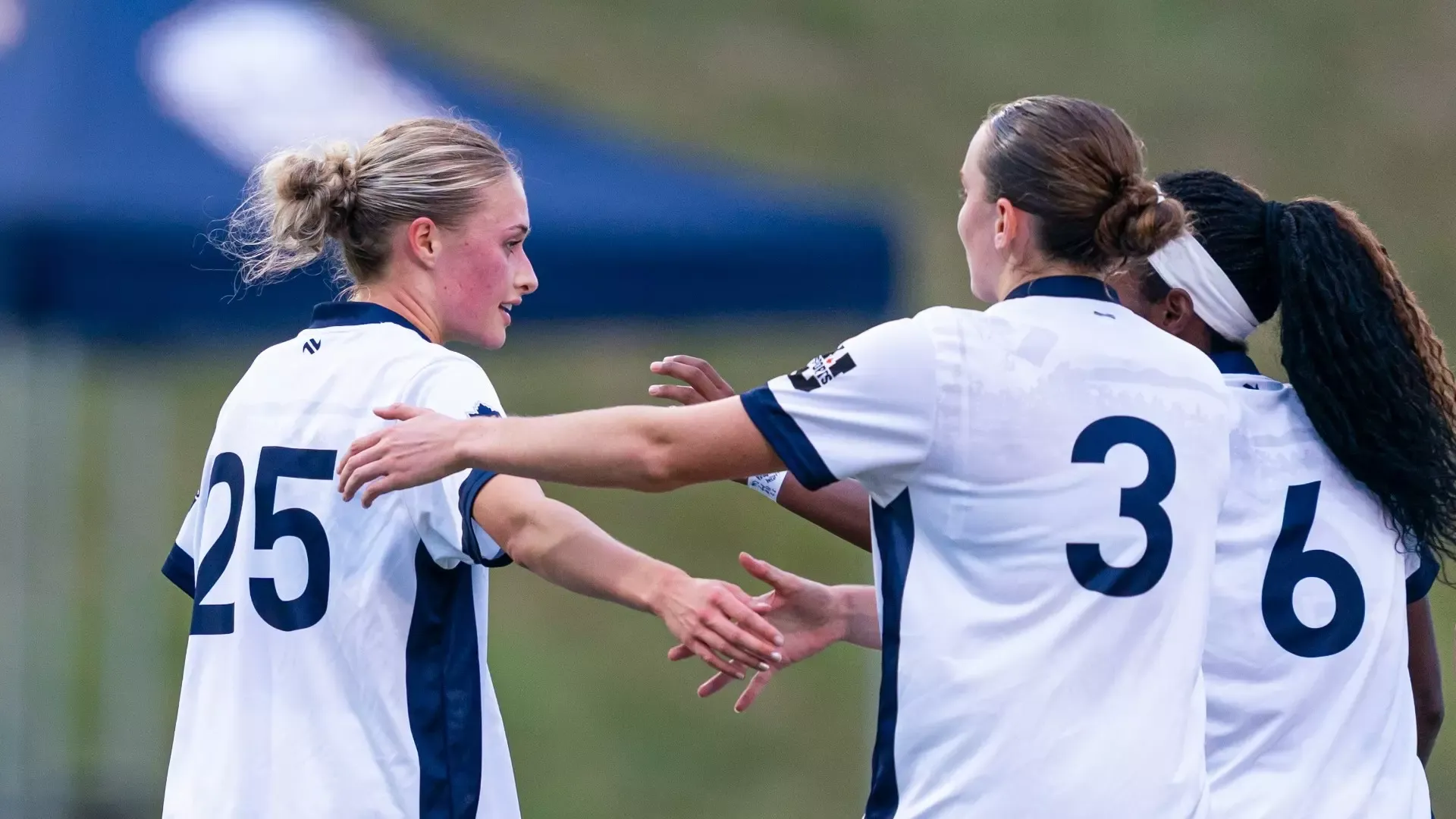 UBC's Nina Rhode celebrates her first-half goal with a pair of T-Birds during a game against the UVic Vikes on Oct. 2, 2026