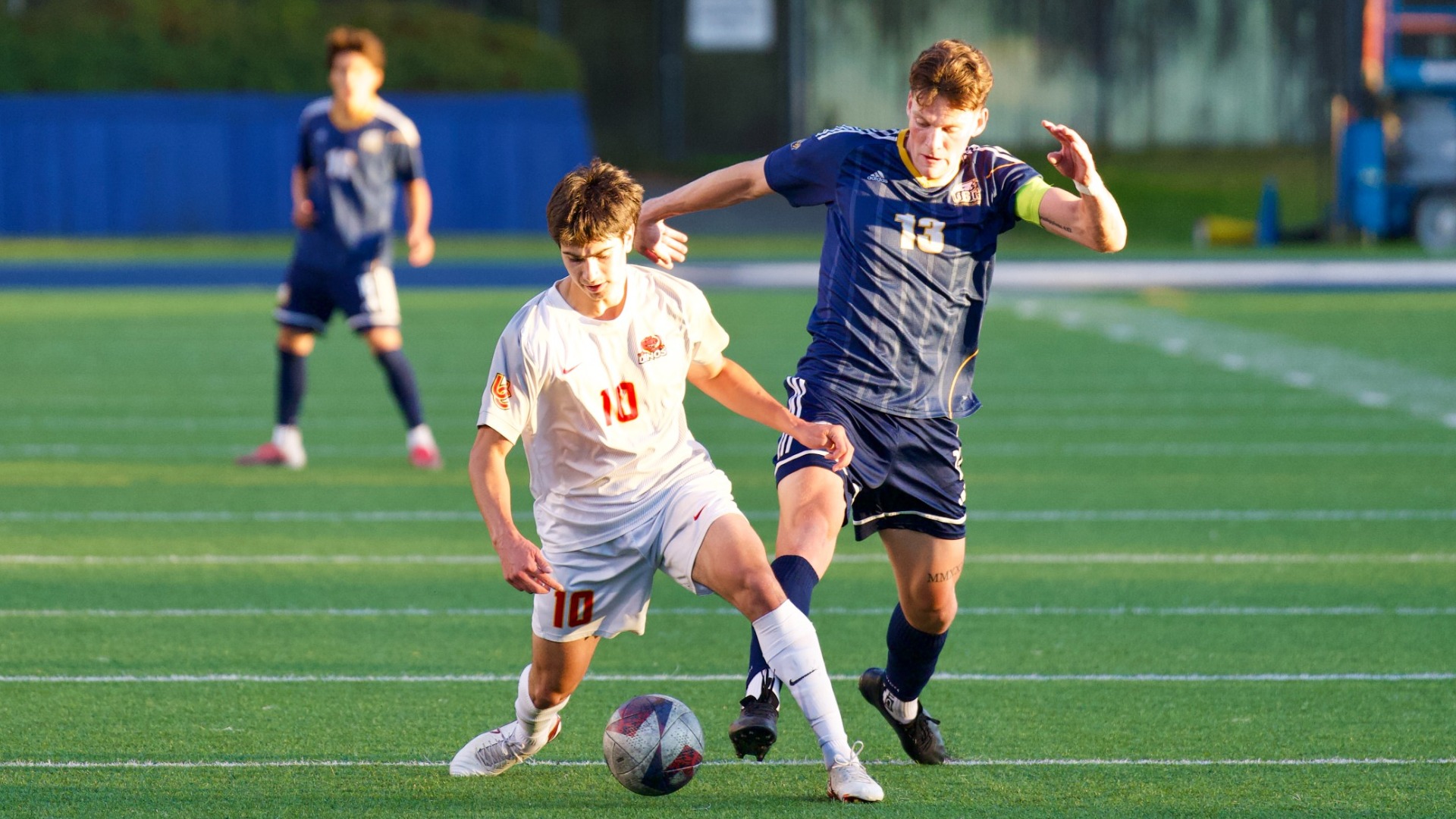 UBC's Eric Lajeunesse battles with a defender for possession near the midfield during a game against the Calgary Dinos on Oct. 3, 2026