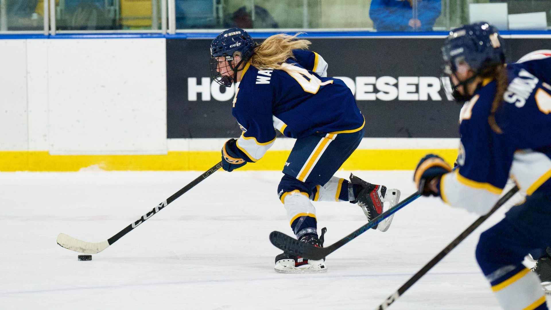 Tayah Wallace carries the puck forward