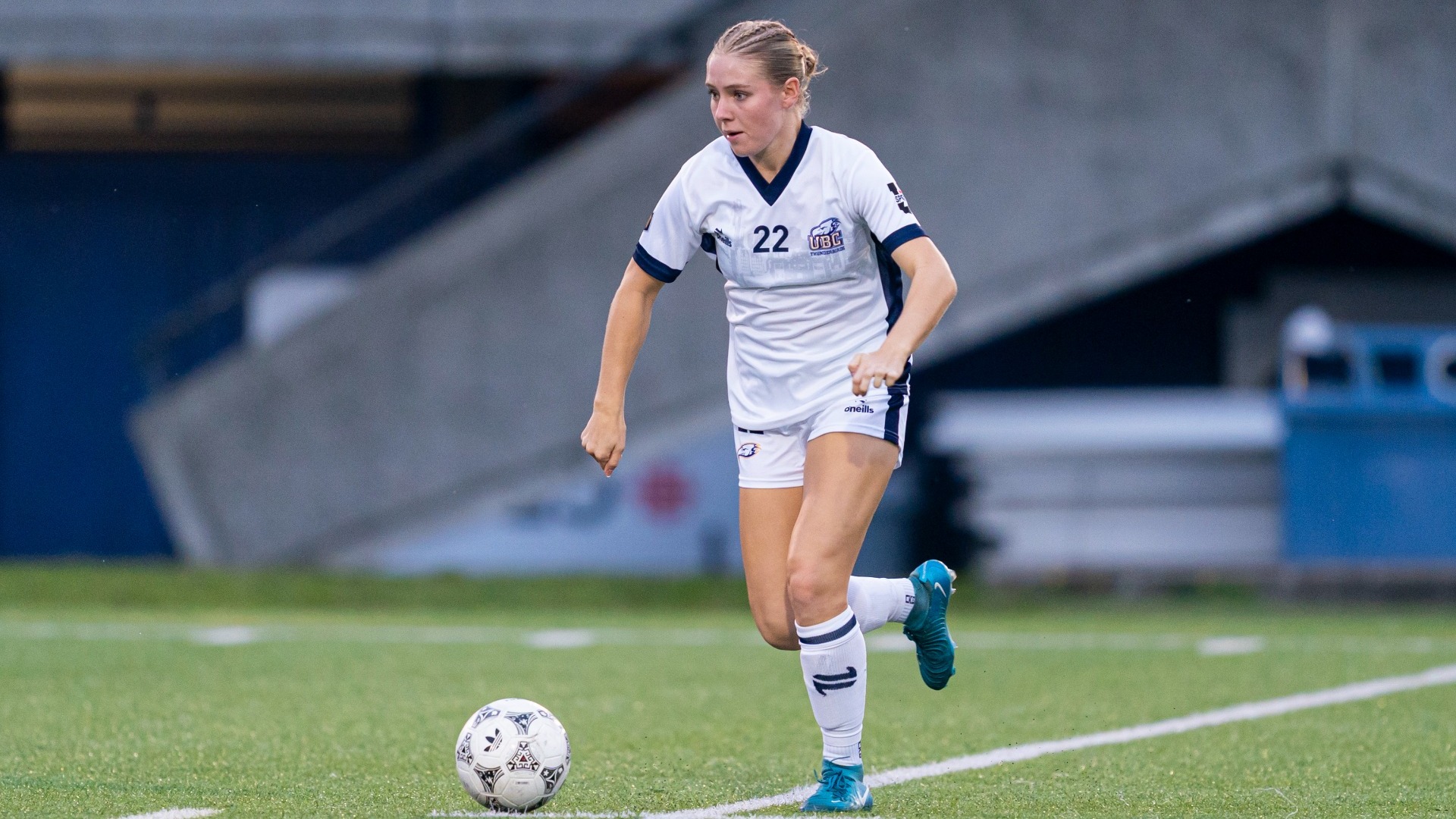 Chloe Van Schalkwyk dribbles the ball forward