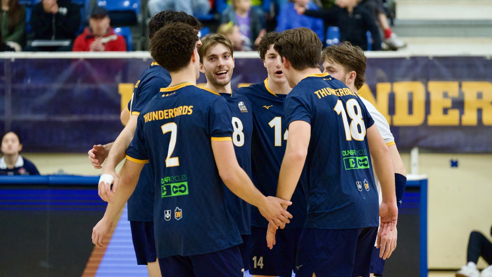 A group of Thunderbirds huddle together after a point