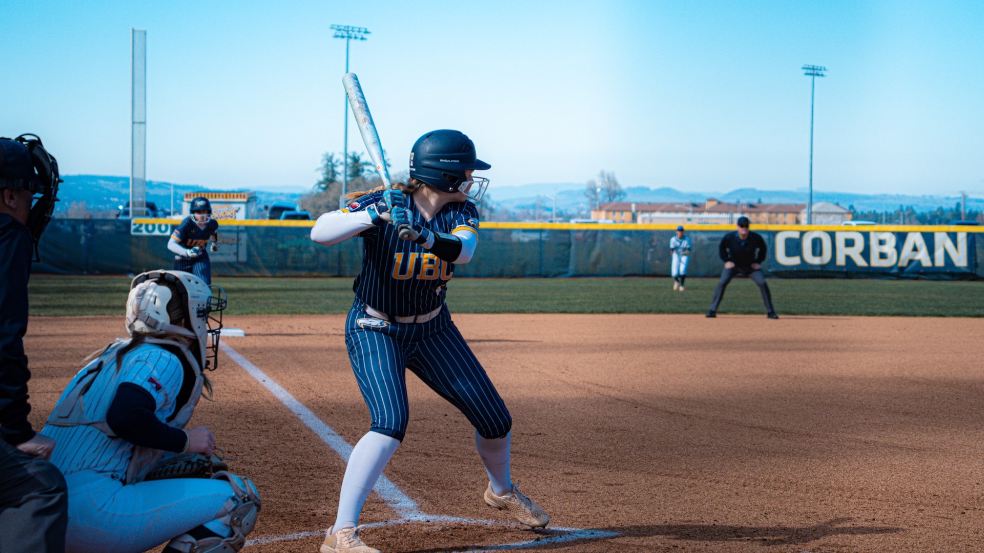 A UBC player stands at the plate waiting for the pitch