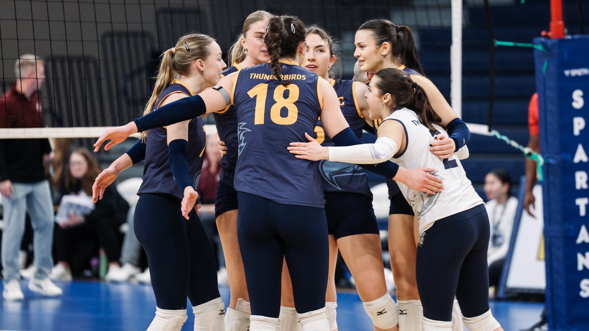 The Thunderbirds come together in a huddle after a point