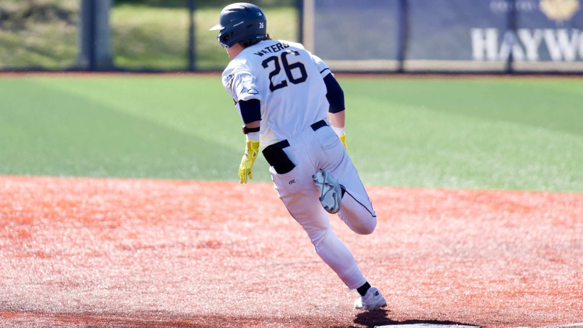 Stephen Waters rounds first base with the ball in play