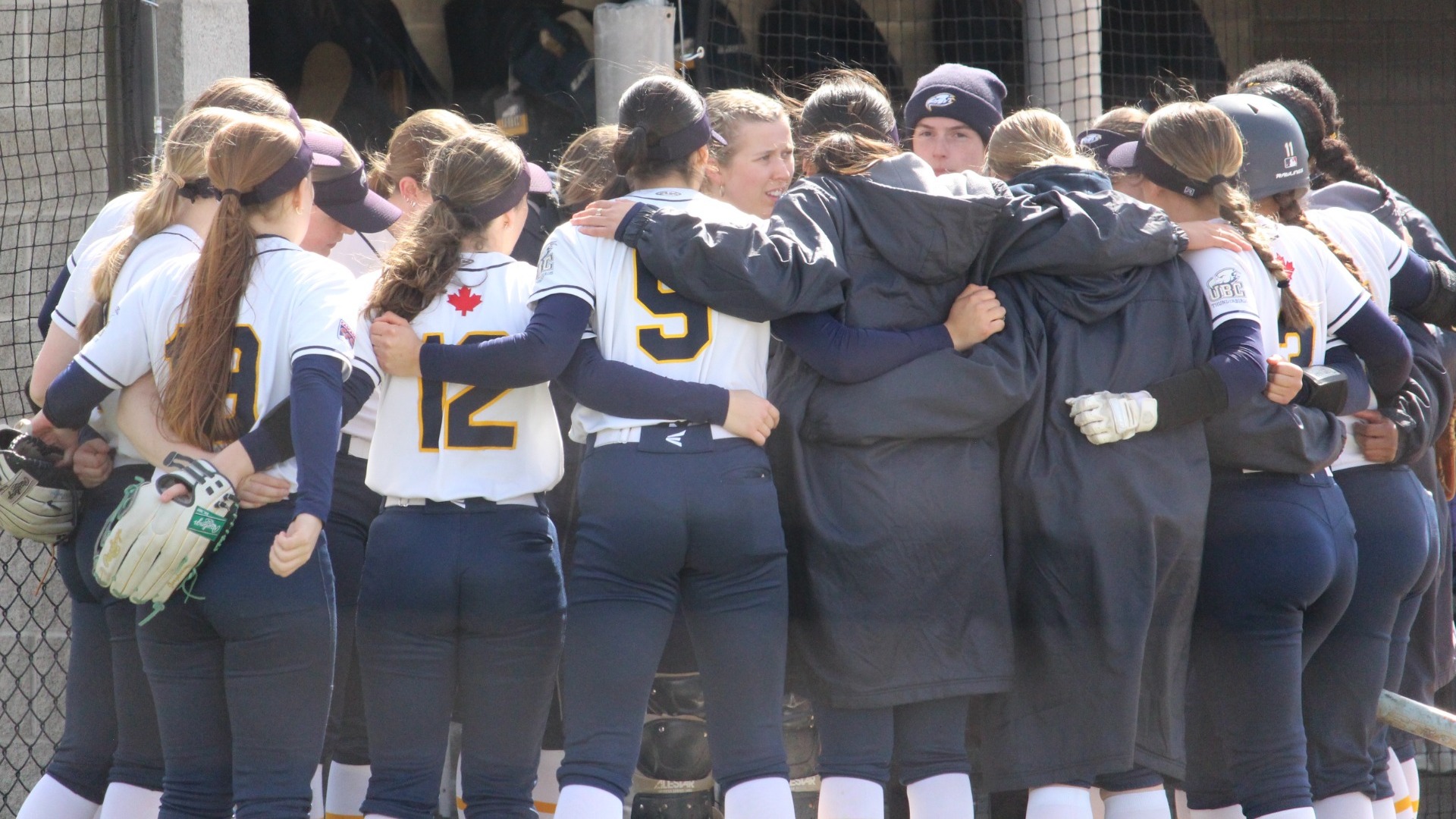 The Thunderbirds team huddle up on the sidelines