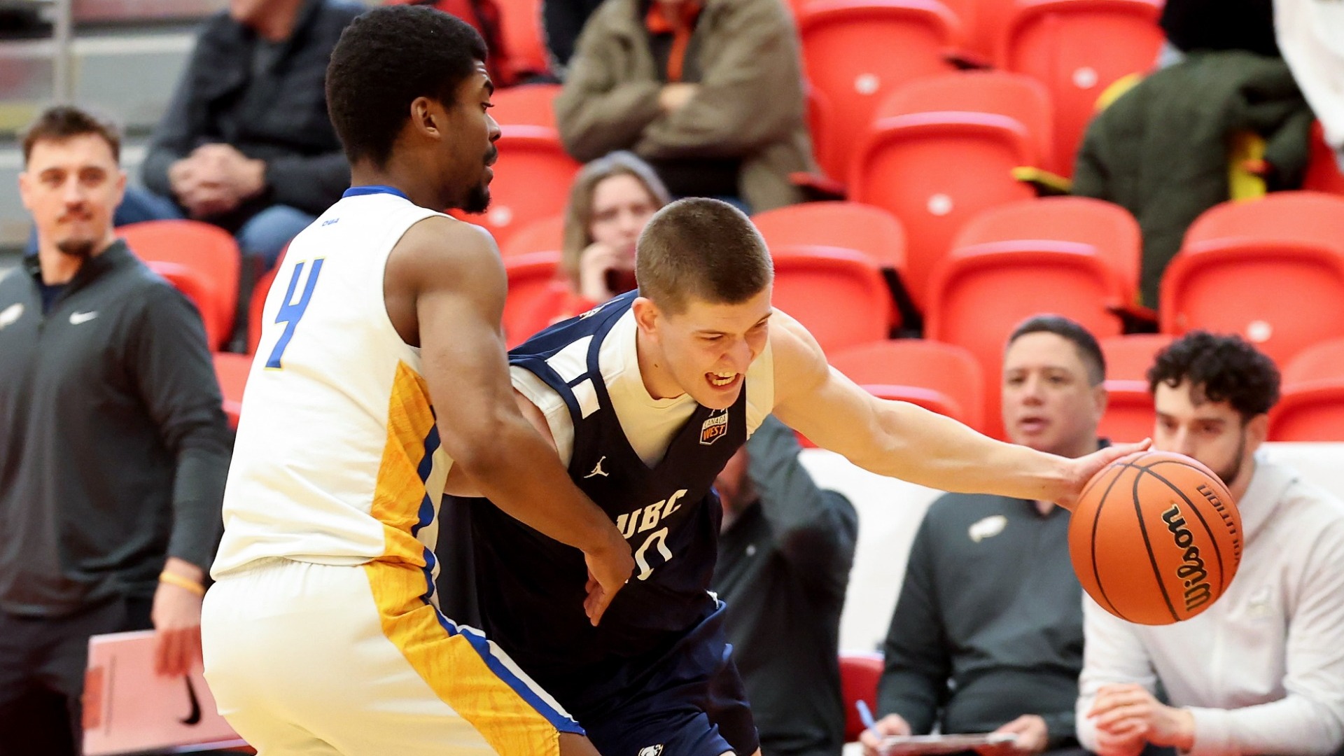 Gus Goerzen tries to drive around a defender that's walling him off