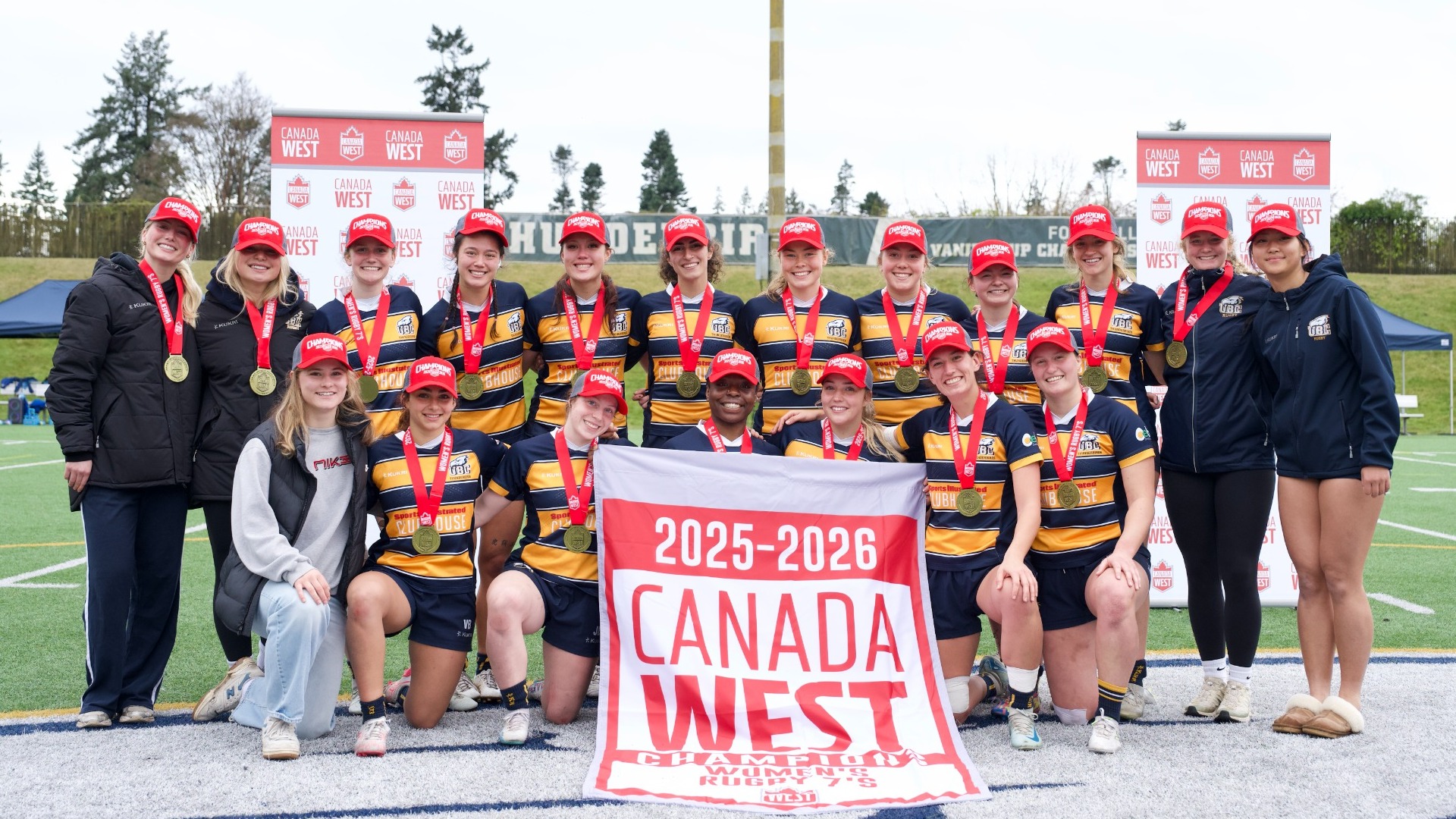 The Thunderbirds pose with their 2026 Canada West Women's Rugby 7s championship banner