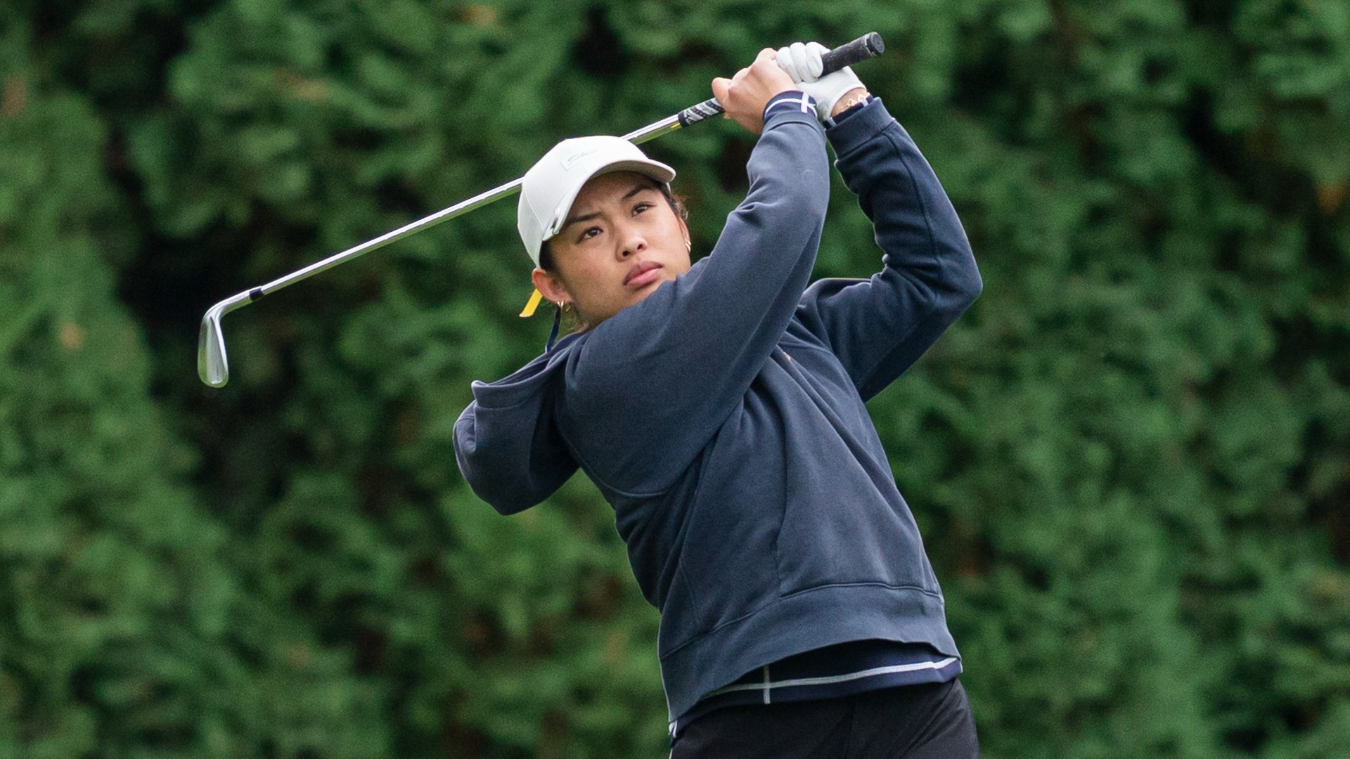 Jessica Ng holds her follow-through after hitting a tee shot