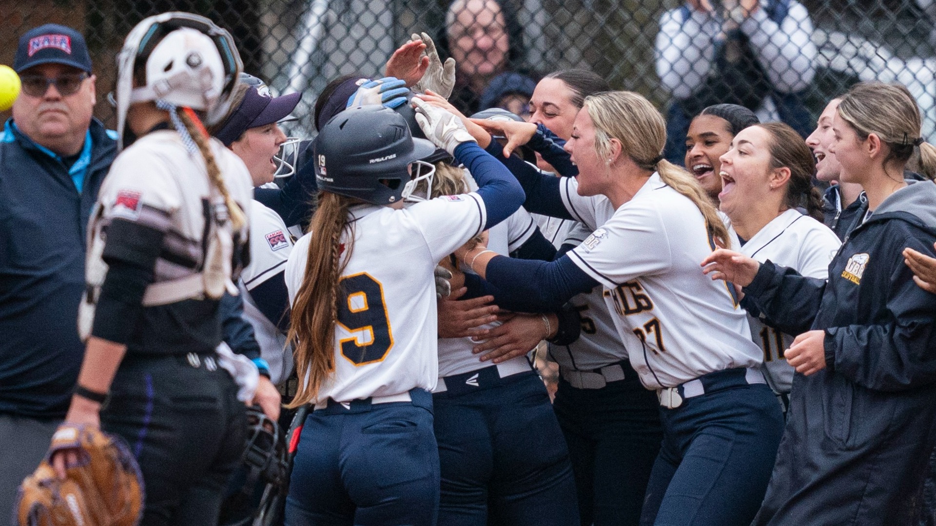 The Thunderbirds celebrate at home plate after the walk-off win