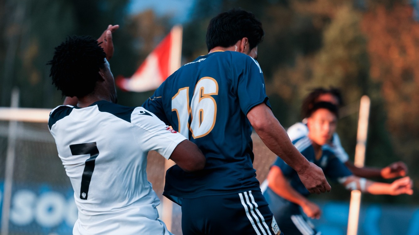UBC's Eric Kim battles with Trinity Western's Elijah Bean for possession (Aug. 29, 2026)