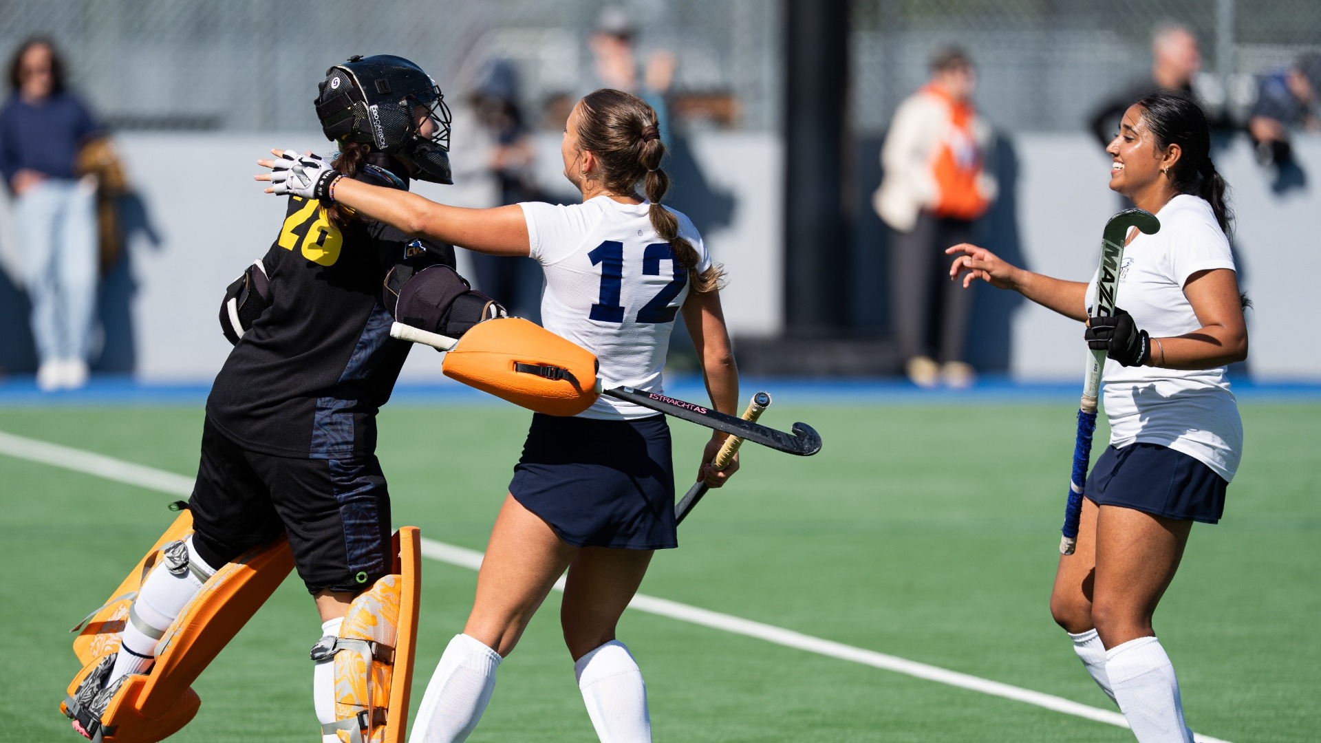 UBC netminder Pascale Pottier celebrates a win with Shyana Ringma and Sukhman Hundal following a game against the UVic Vikes on Sept. 26, 2026