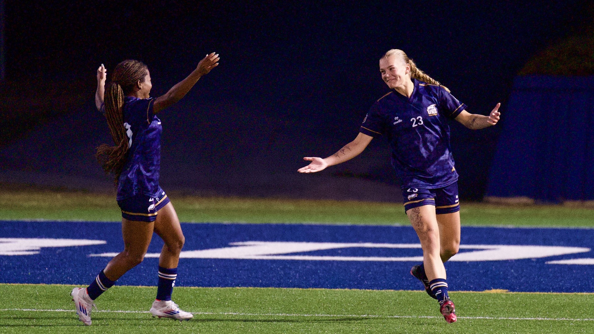 UBC's Maddy Norman opens her arms to welcome teammate Jayda Thompson to celebrate after her second-half goal during a game against the TWU Spartans on Sept. 26, 2026