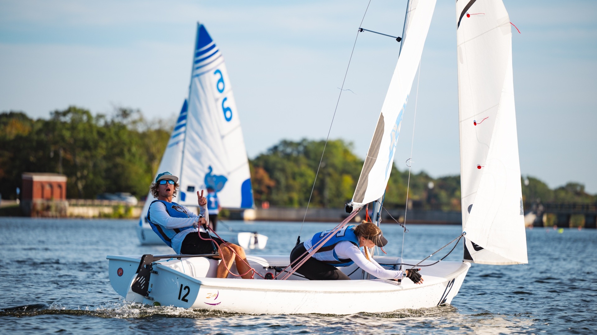 Ben Mueller and Kate Castleberry sail at practice on Upper Mystic Lake.