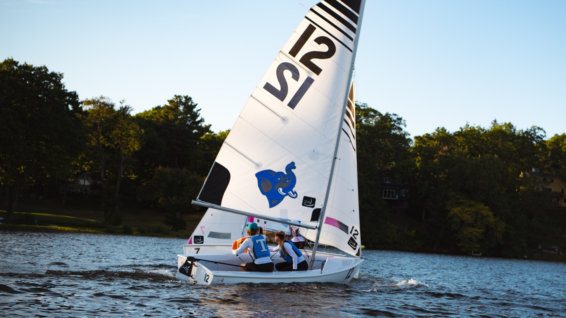 Ben Mueller and Kate Castleberry work together at practice on Upper Mystic Lake.