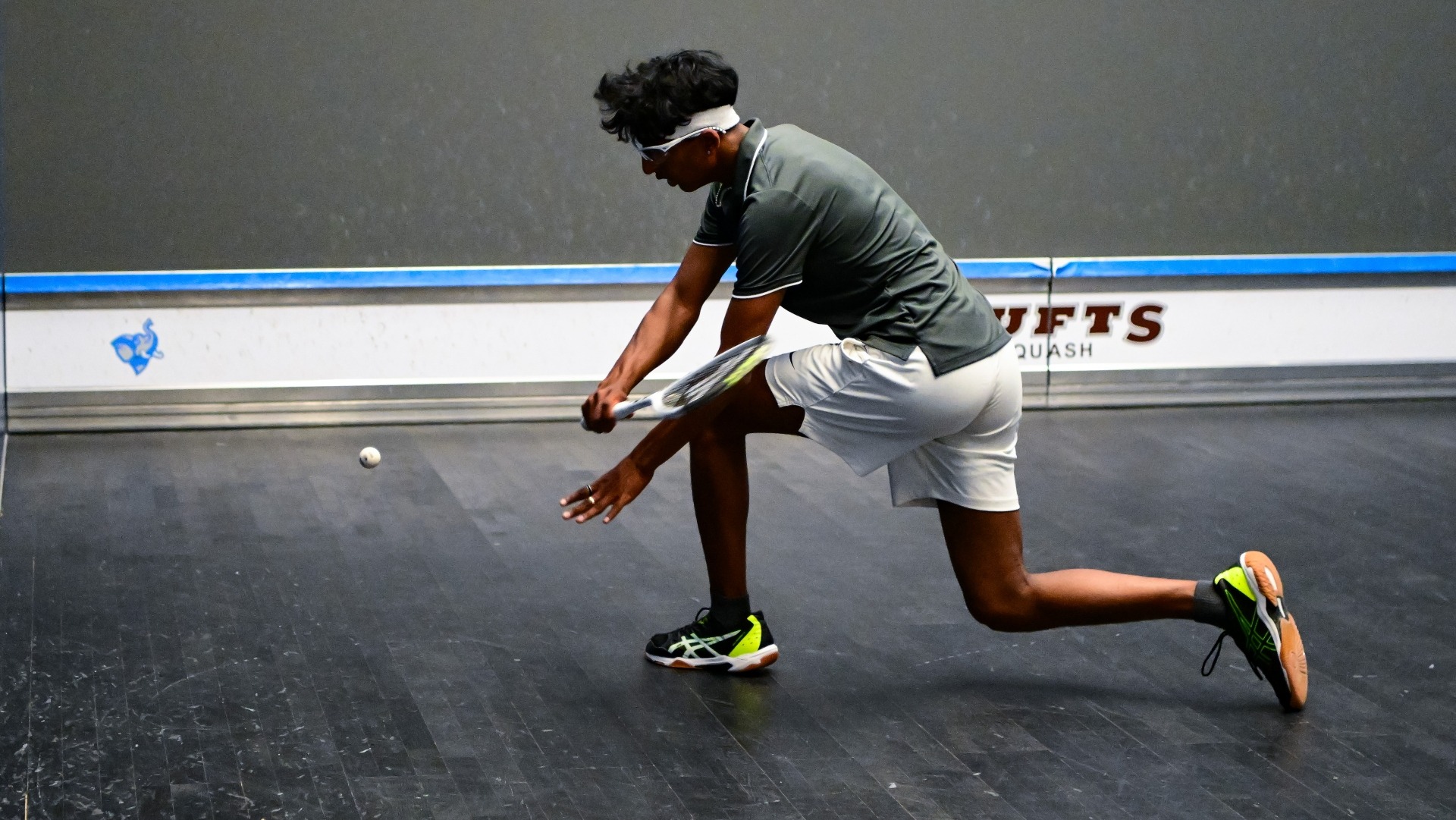 Desai reaches for a shot in a men's squash match against Dartmouth.