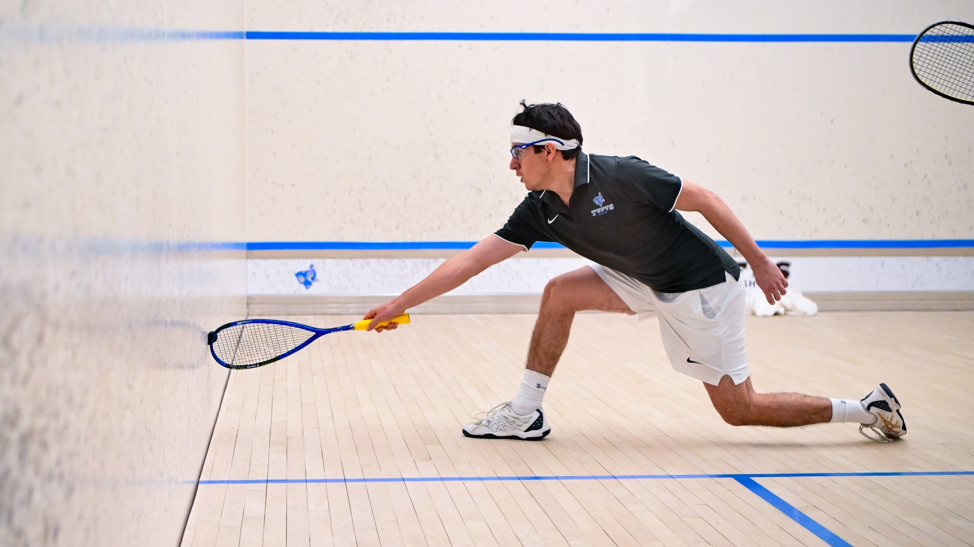 Santiago Medina Carrillo  reaches for a shot at Tufts Squash Center.