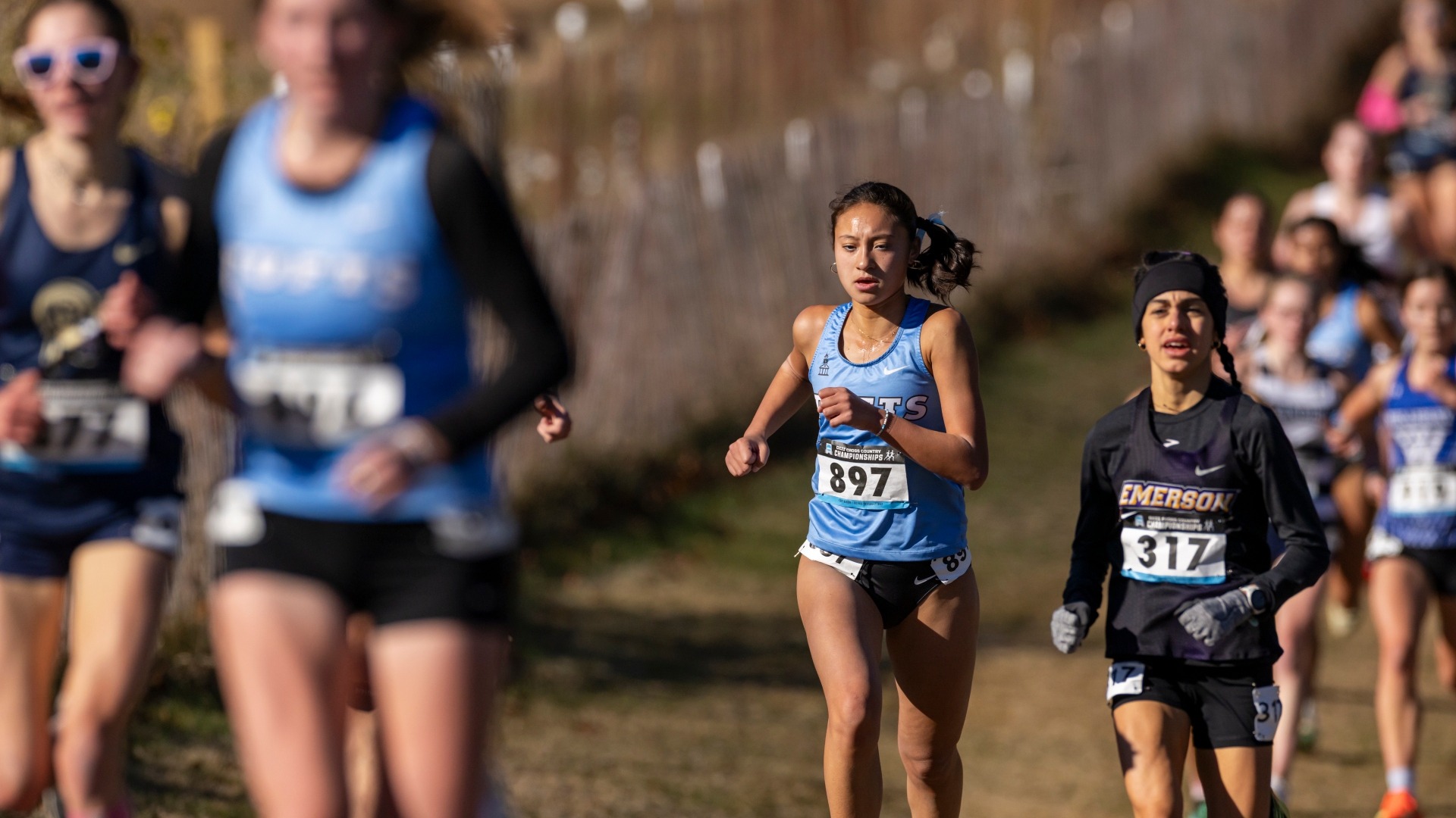 Zoe Margolies at the front of the pack with Liz Donahue in the foreground.