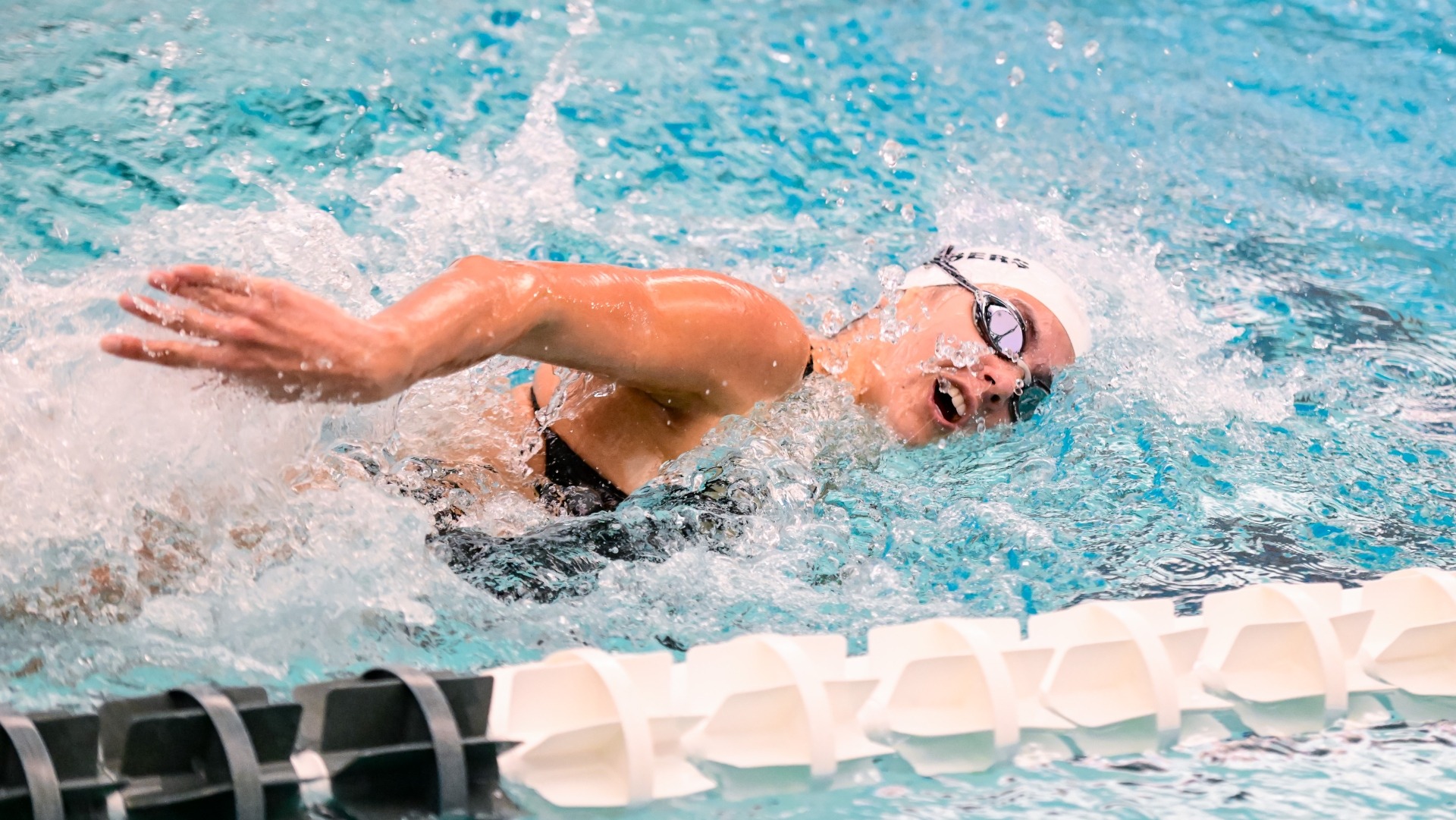 Isa Chambers swims in a freestyle event in a meet at Brandeis University.