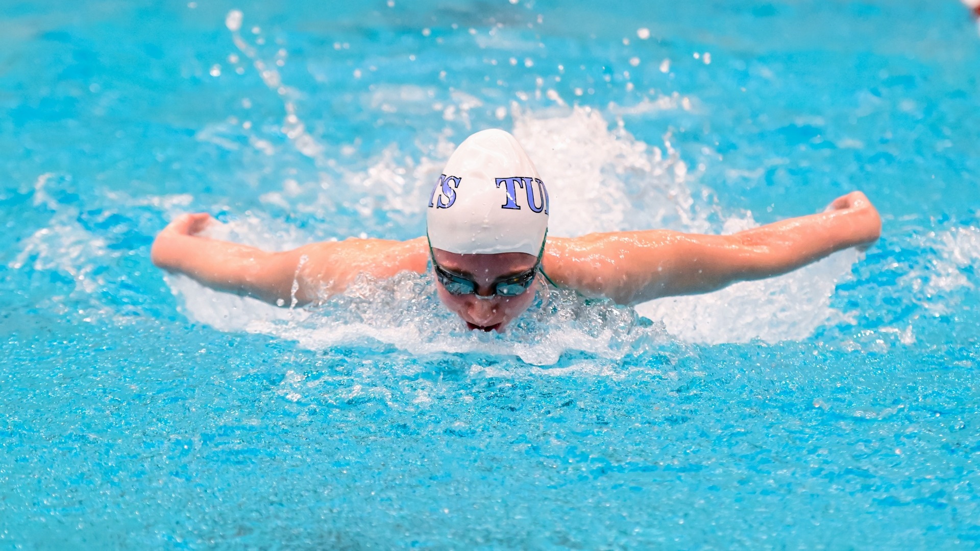 Lila Strober competes in a butterfly event for the Jumbos.