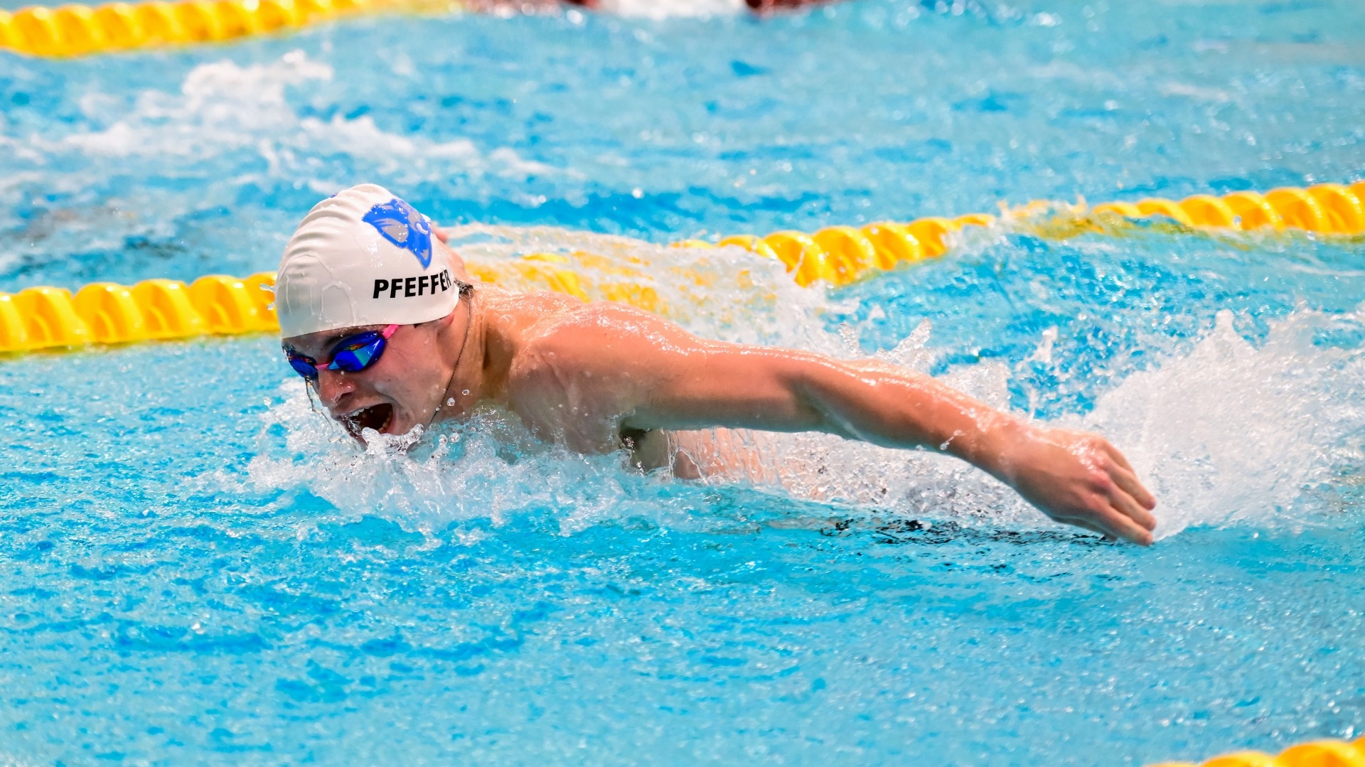 Tufts' Nate Pfeffer competes in the butterfly during the 2024-25 season.