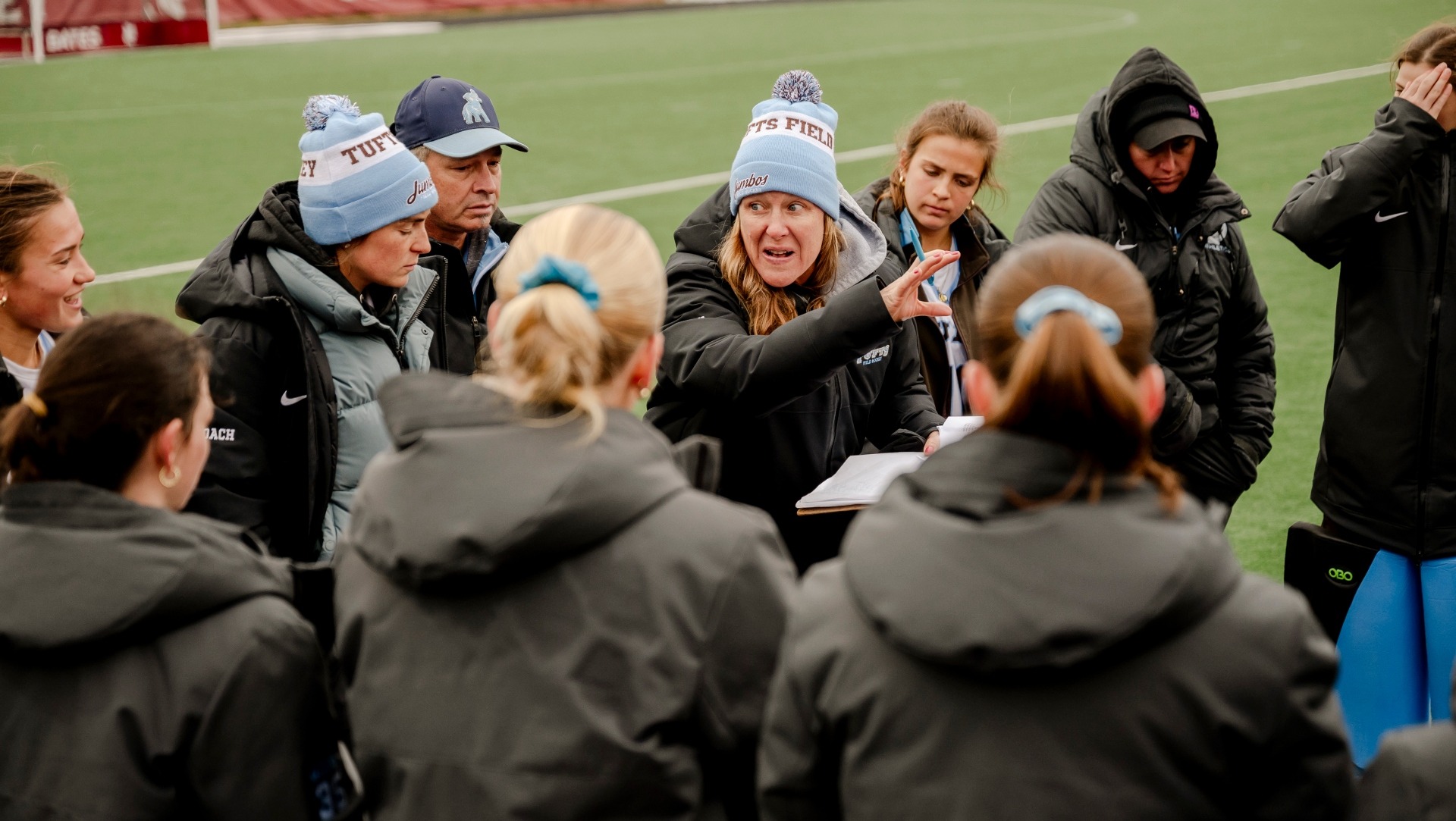 Coach Mattera and her staff give directions to the Jumbos.