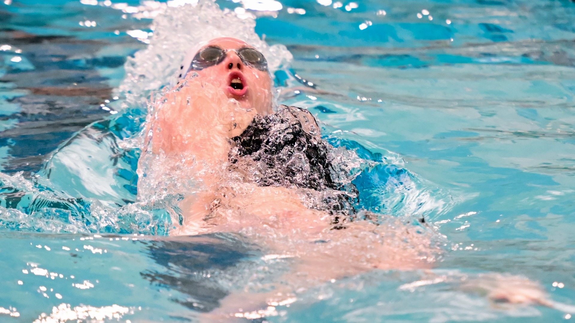 Olivia Pettit competes in the backstroke for the Jumbos.