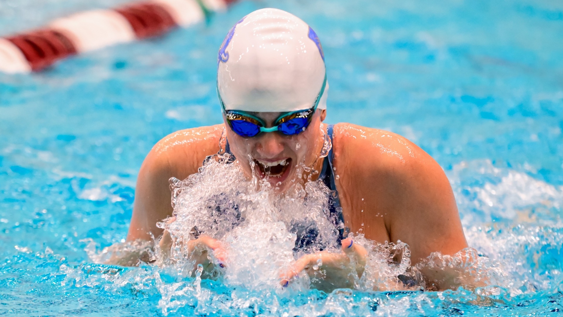 Sydney Stasz swims in the individual medley for the Jumbos.