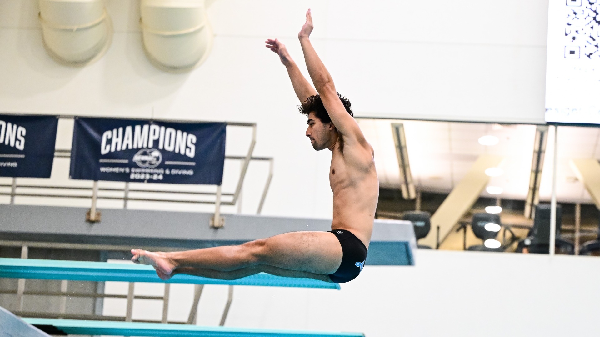Jay Wilkinson competes in the diving events at MIT.